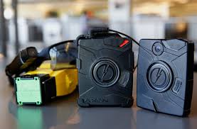 body cameras police taser shutdown increase departments selling technology international store videos pros bloomberg fallon patrick via